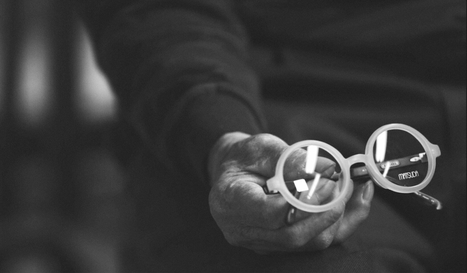 A Matsuda frame held in a craftsman's hands